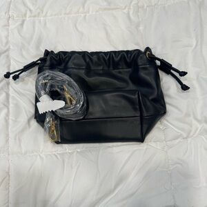 Black Melie Bianco vegan leather bucket bag with detachable long crossbody strap